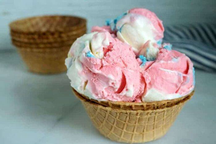 red, white and blue ice cream scoops in ice cream cone bowls.