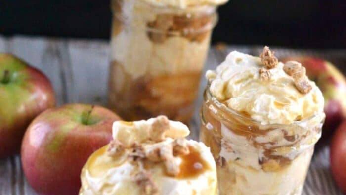 Love Mason Jar Desserts? So do we! This Apple Pie Caramel Cheesecake Recipe is so easy to make. We love sharing easy no bake dessert recipes!