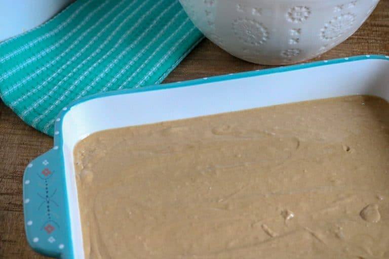 Apple spice poke cake batter in a 9x13 cake pan before baking