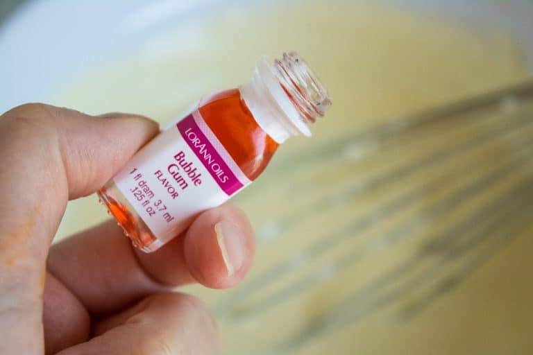 person's hand shown holding a bottle of bubble gum flavor liquid for bubble gum no-churn ice cream