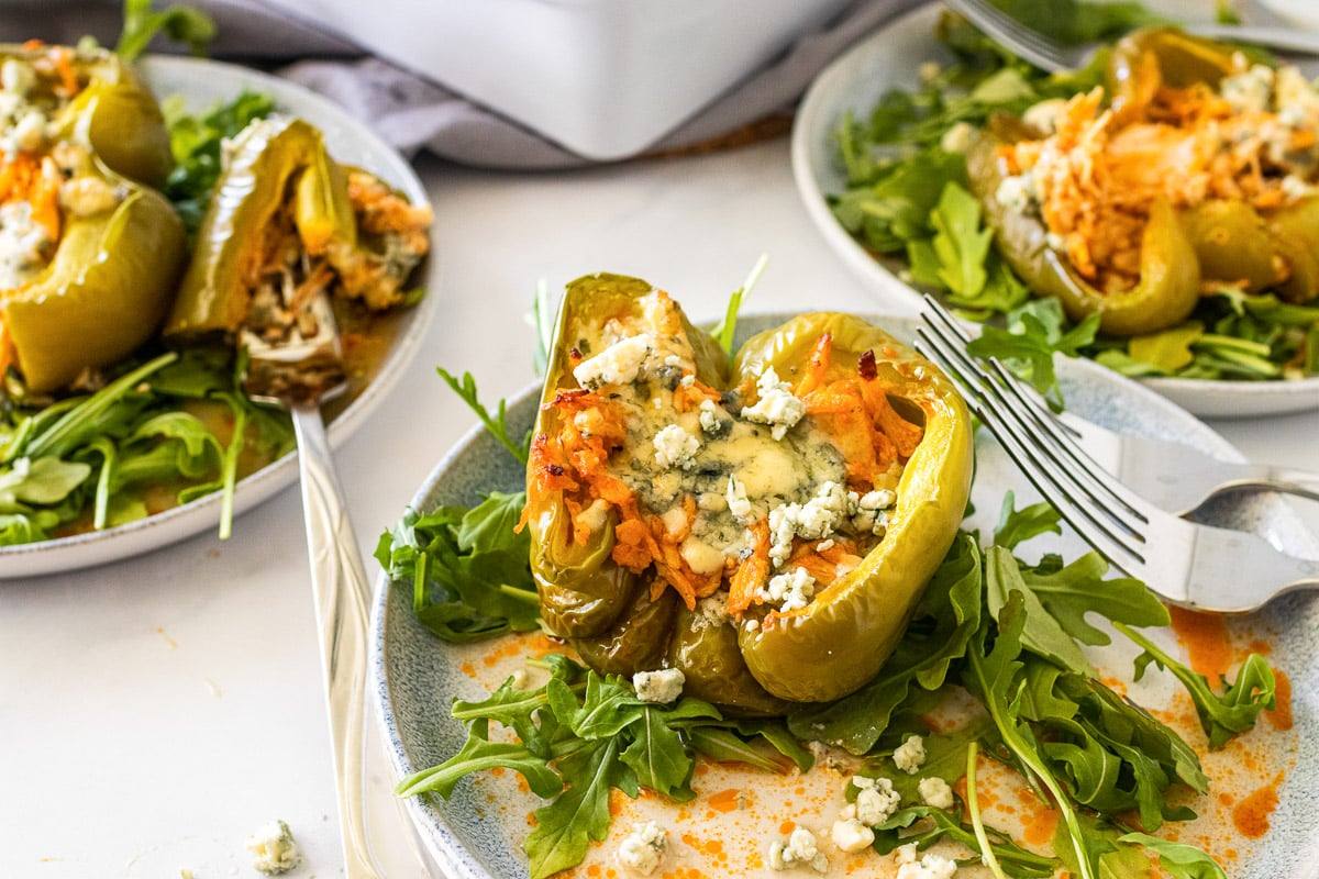 three buffalo chicken stuffed peppers individually plated