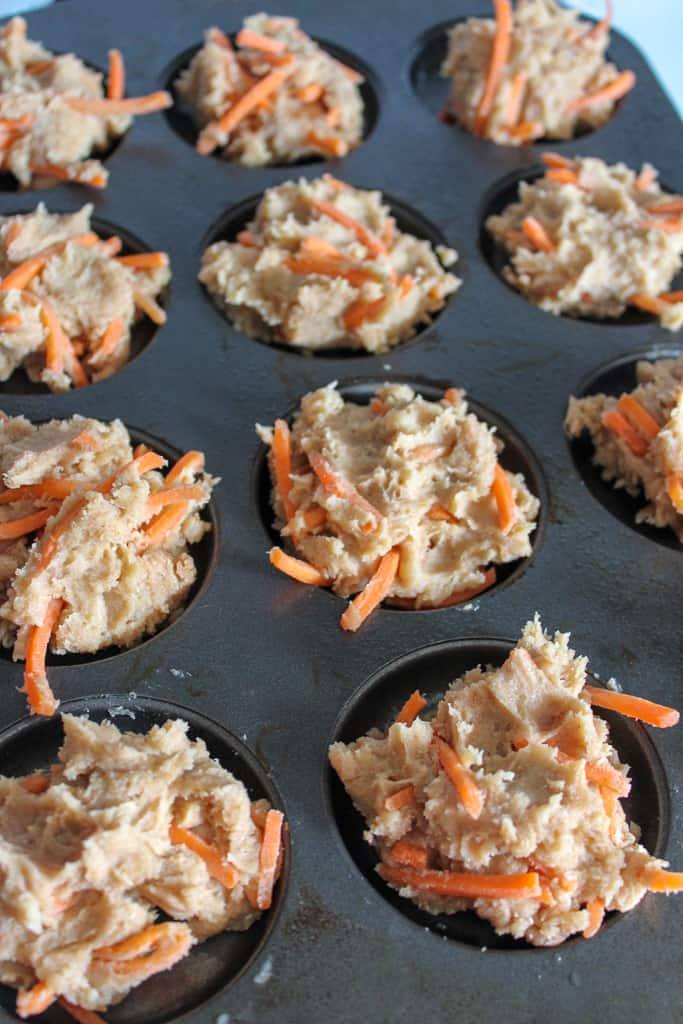 carrot cake cookies batter inside a muffin tin