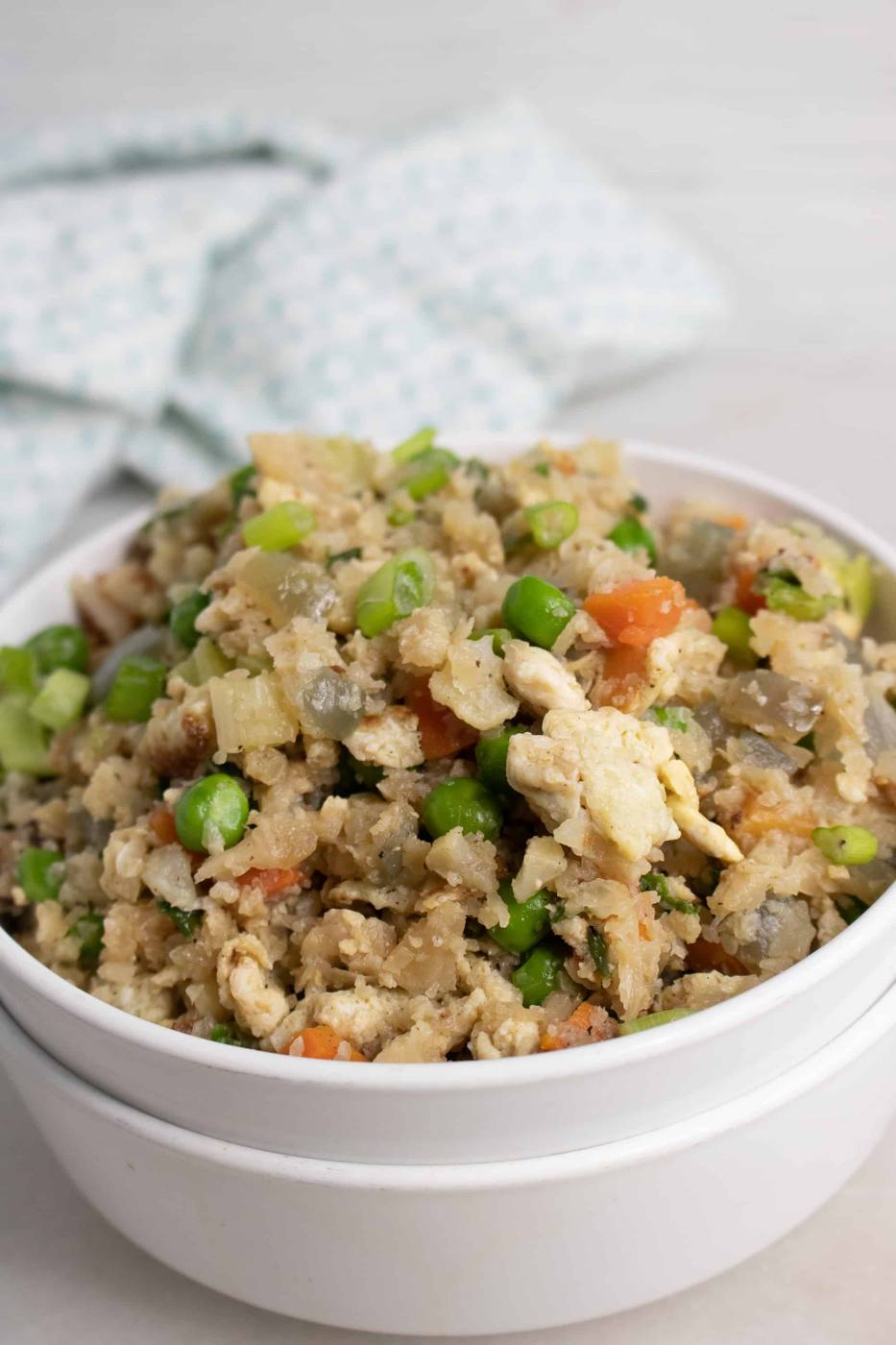 Cauliflower Fried Rice in double white ceramic bowl