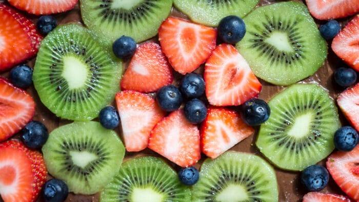 Chocolate fruit pizza is always a total crowd pleaser. With chewy sugar cookie, creamy chocolate cream cheese topping & fresh berries - you can't go wrong!