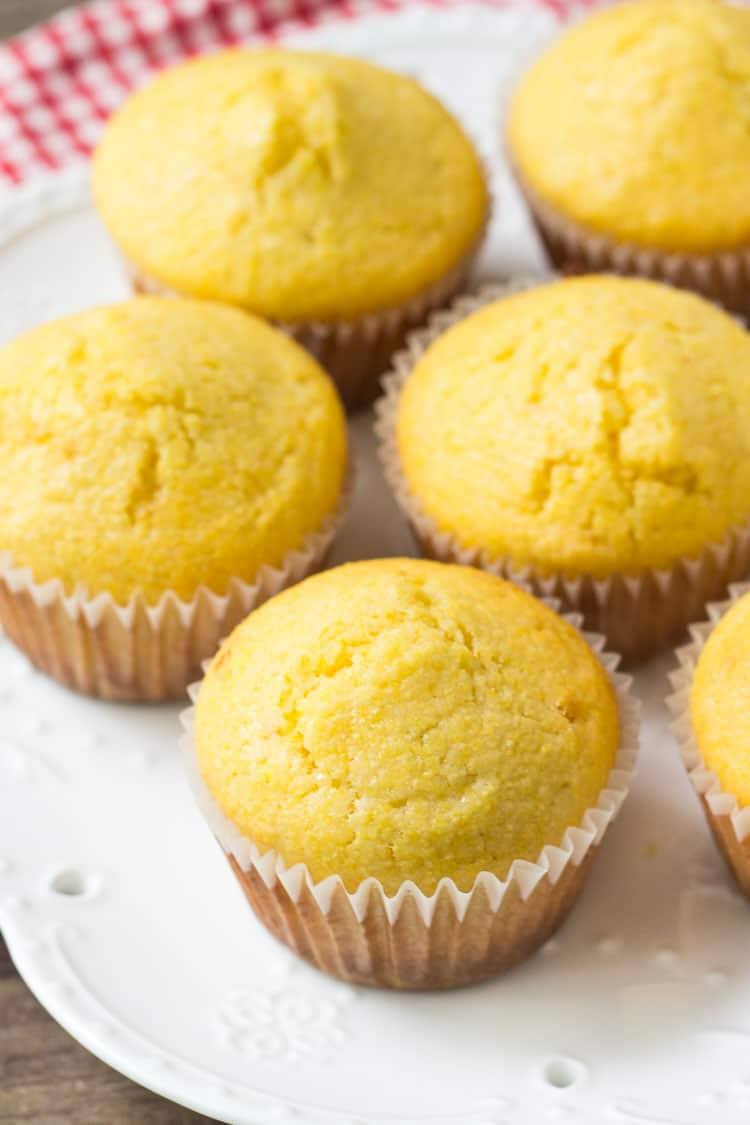 a plate of cornbread muffins being served