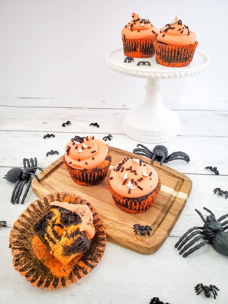 Halloween cupcake with orange and black frosting and Halloween sprinkles