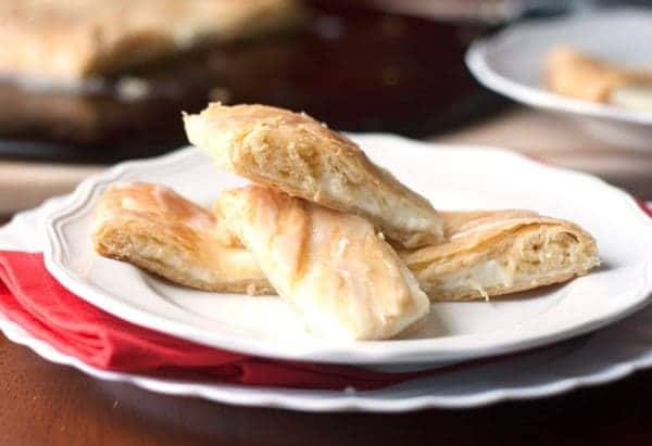closeup of easy Cream Cheese Danish on a white plate over a red towel