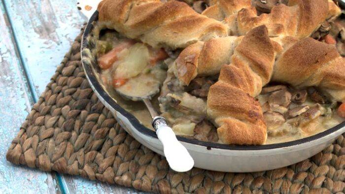 Chicken Pot Pie perfect for a potluck. This recipe is a comfort food favorite with flavor you won't soon forget. Make this for dinner & take it to potlucks.