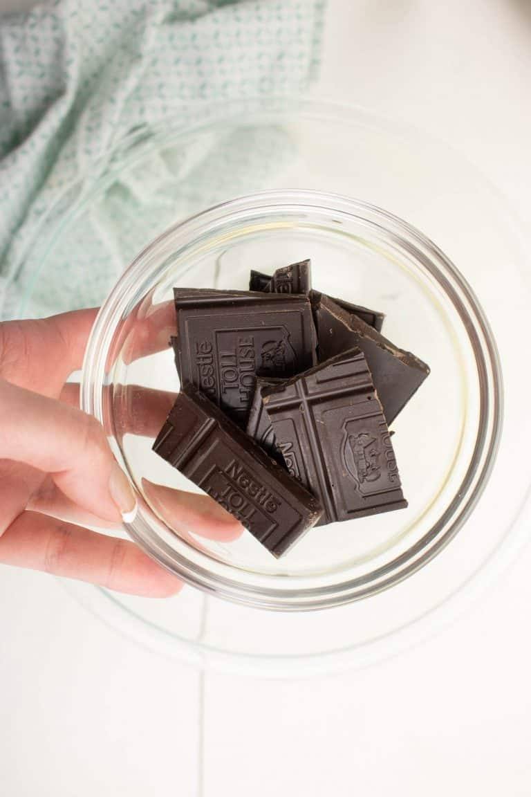 Dark chocolate pieces for Dark chocolate brownies in small clear bowl