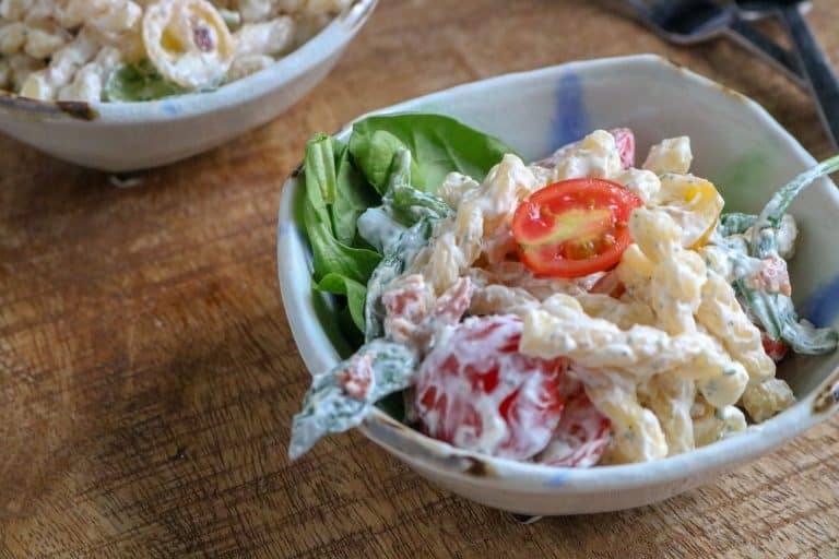 two portions of Delicious BLT Pasta Salad served in white bowls
