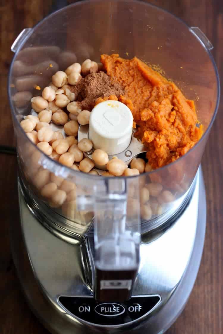Chickpeas, pumpkin puree, and pumpkin pie spice in a food processor before blending