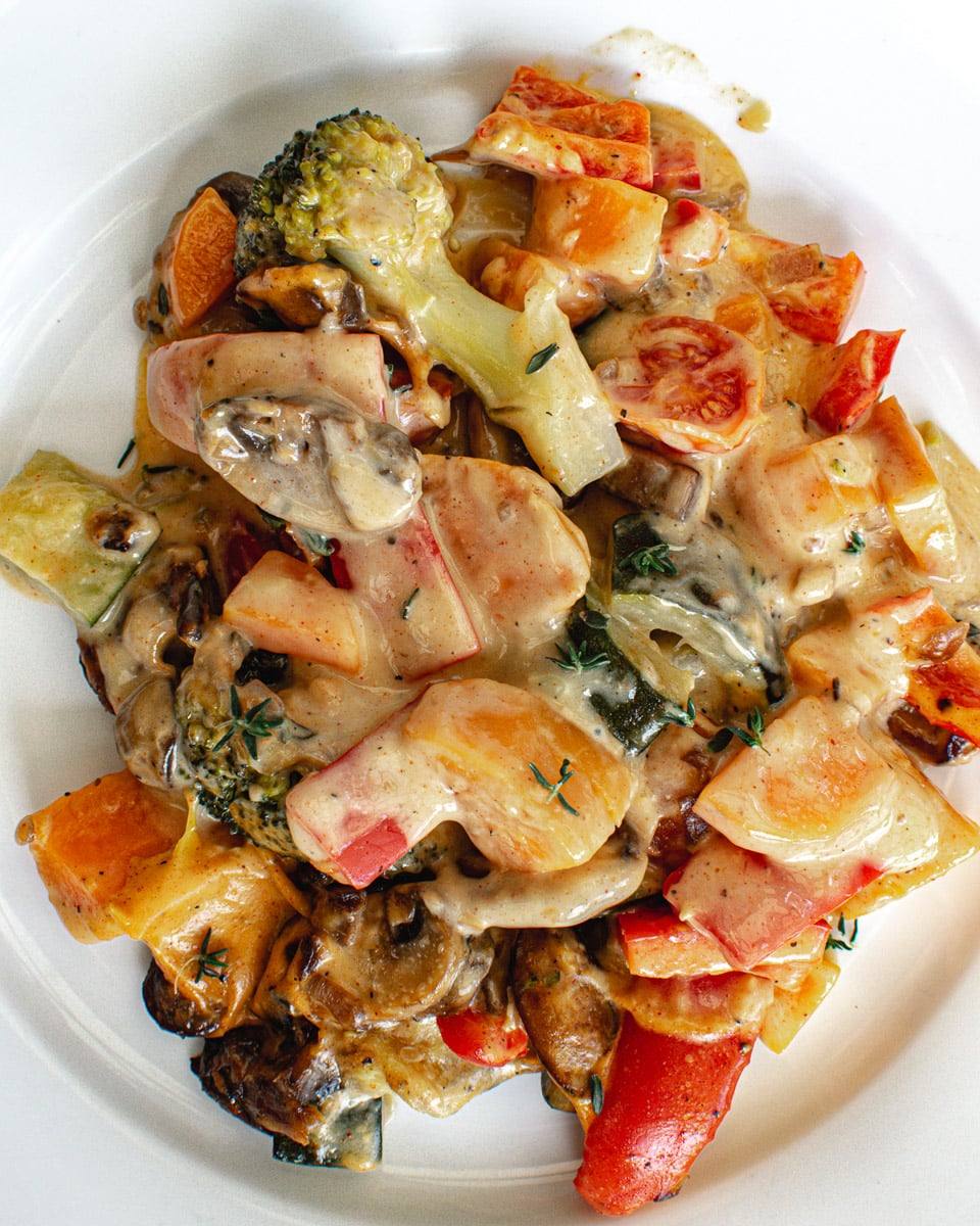vegetables in cheese sauce on plate