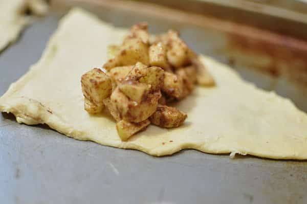wrapping apple pie filling in the dough