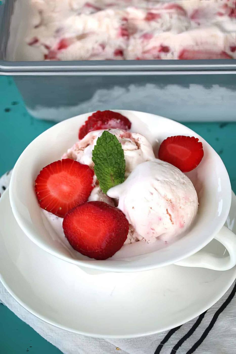 homemade strawberry ice cream being served in a bowl