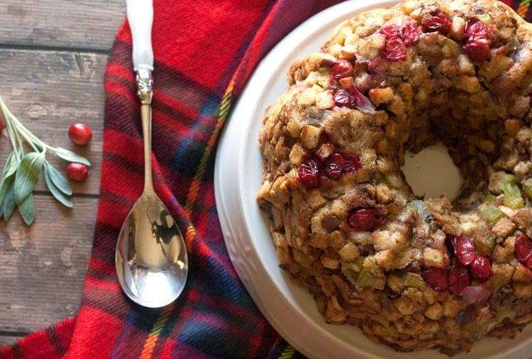 Fresh cranberry stuffing baked in a bundt pan and garnished with fresh cranberries