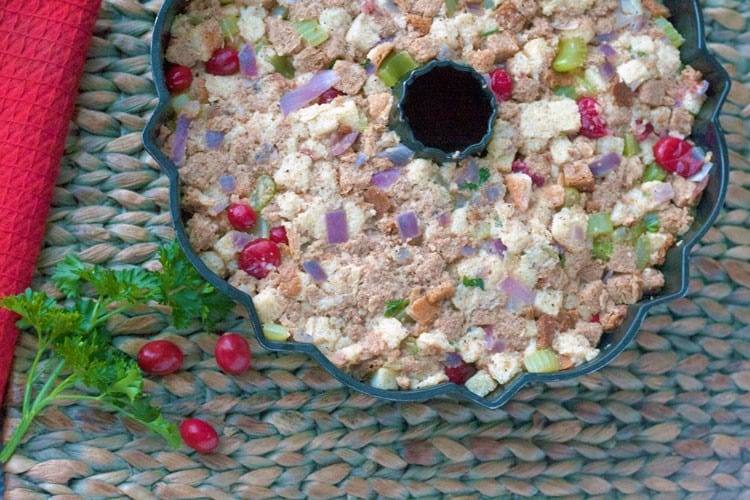 Cornbread cranberry stuffing in a white serving dish ready for a holiday table