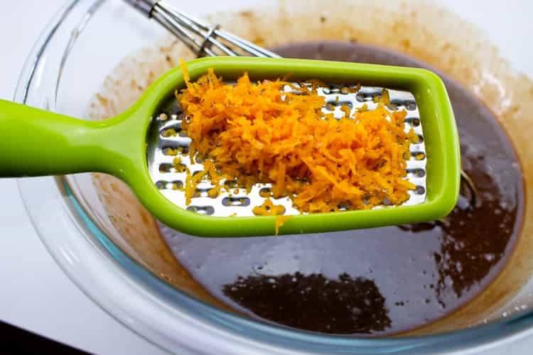 adding grated orange zest to chocolate mousse
