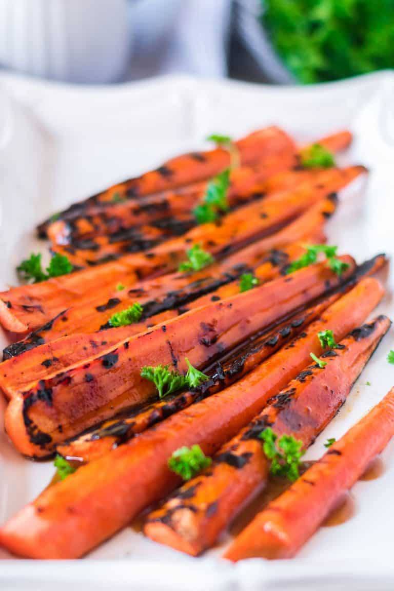 grilled carrots on a platter
