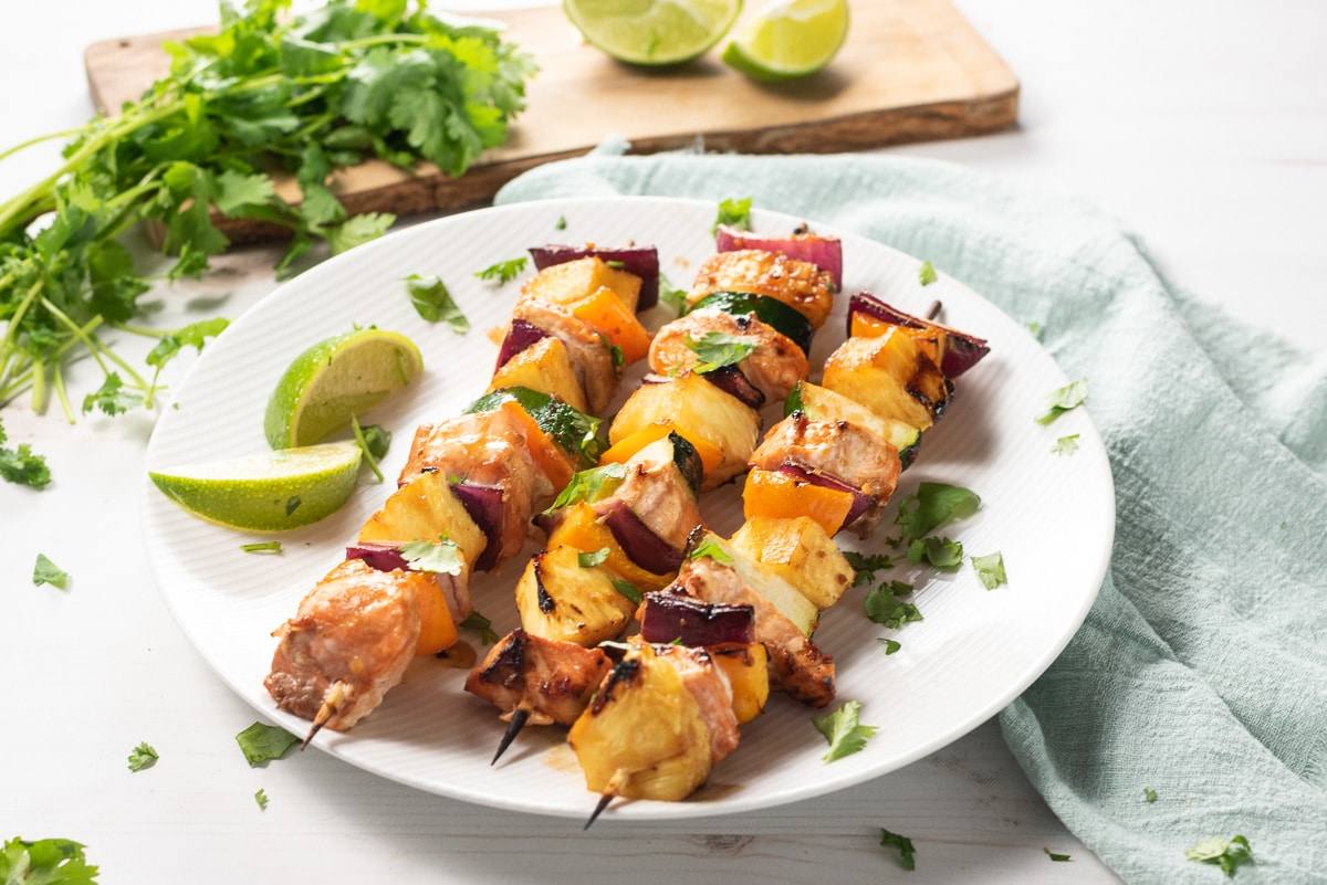 grilled salmon kebabs being served