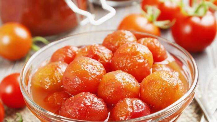 Canning tomatoes. Learn how to can tomatoes with this easy recipe that you can use every year to can tomatoes from your garden or farm stand. Canning tomatoes is easy and they are so tasty when captured at the peak of ripeness.