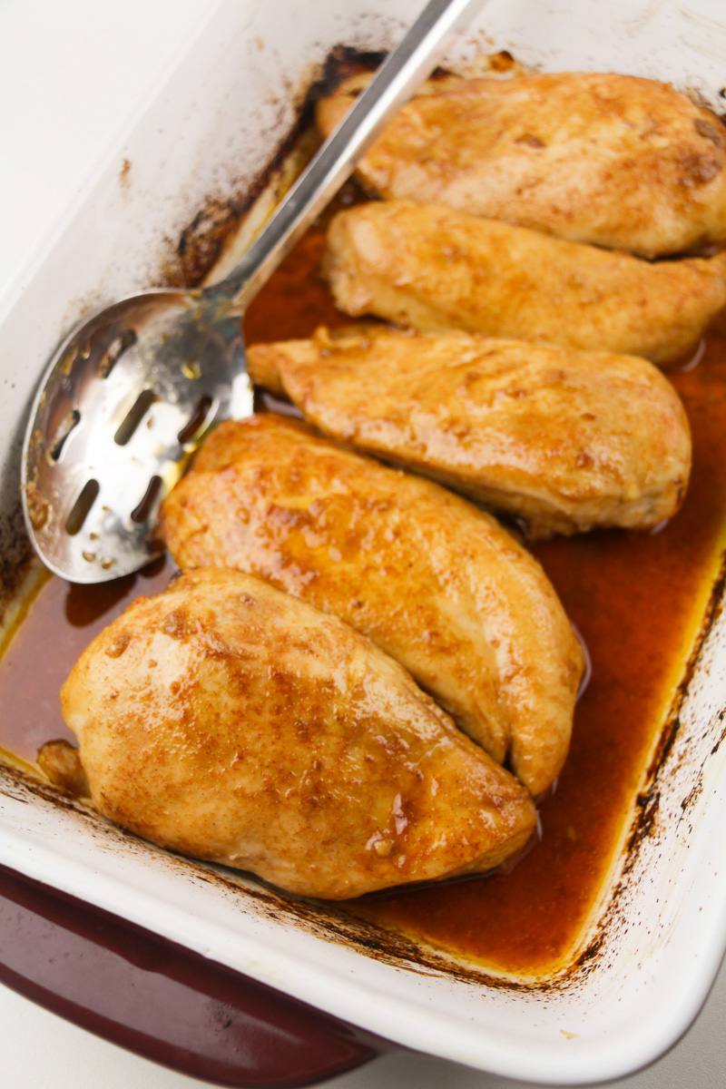 tray of baked chicken in marinade