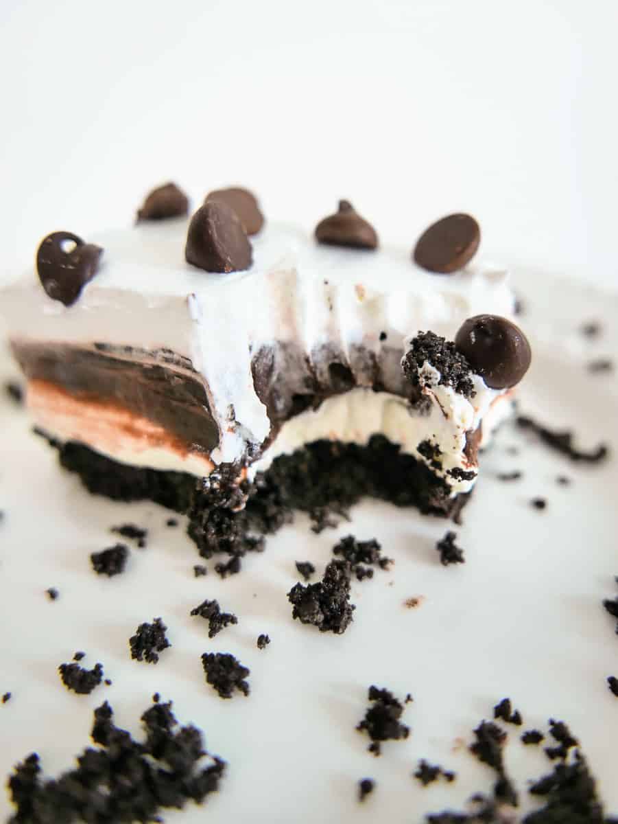 close up slice of chocolate lasagna with a bite taken out