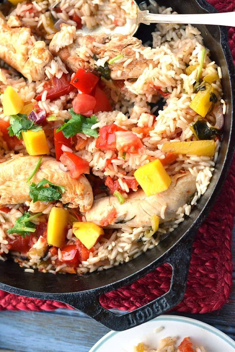 mango chicken and rice in a skillet
