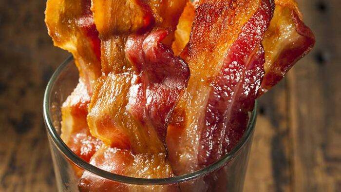 oven cooked bacon is easy to make. Cook oven fried bacon in the oven for an easier way to make bacon. This is a simple no hassle cooking method that we've used repeatedly to make bacon in the oven.