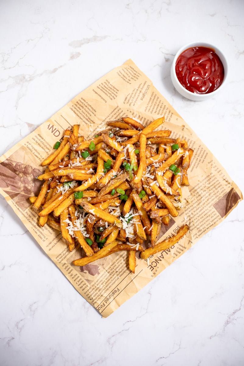 parmesan truffle fries being served