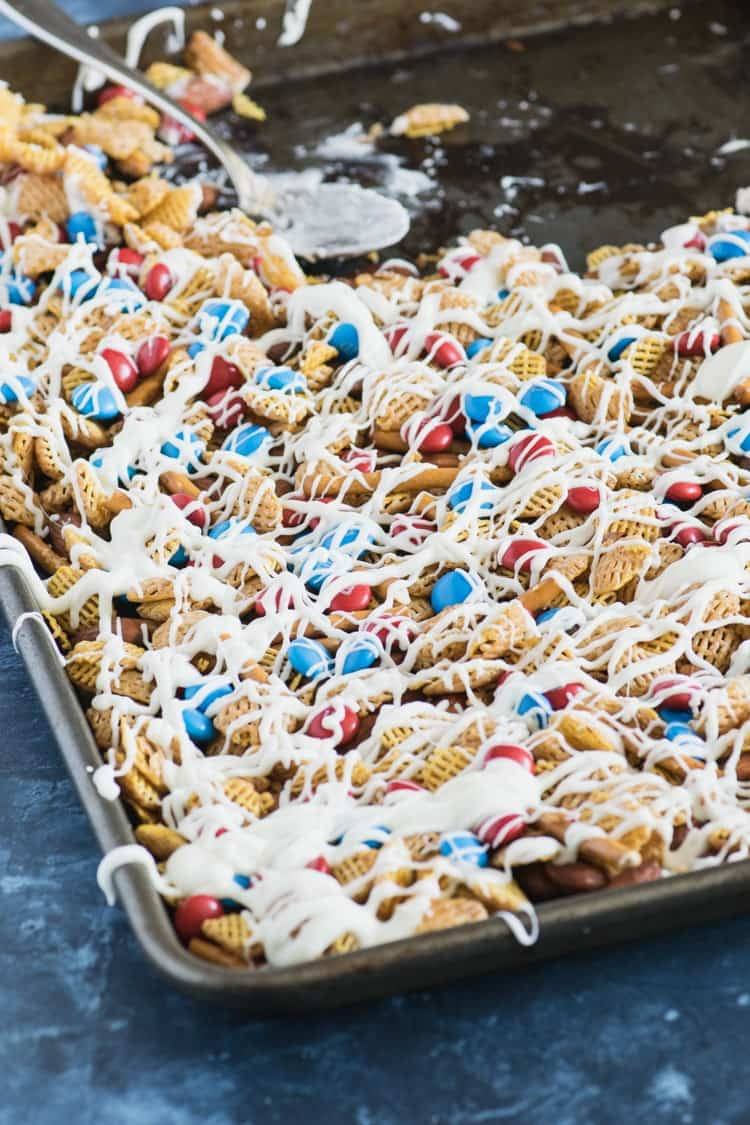 This July 4th party snack mix is drizzled with white chocolate for a sweet and tasty treat!