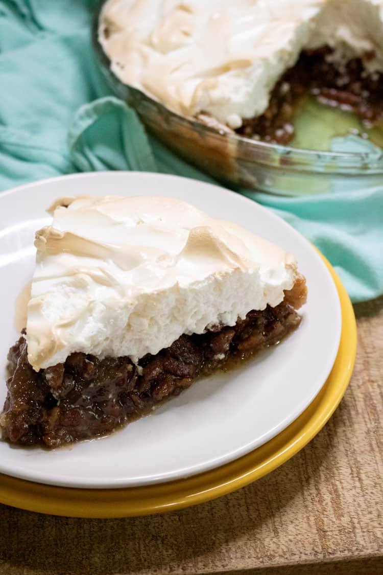 pecan pie with meringue slice on a plate