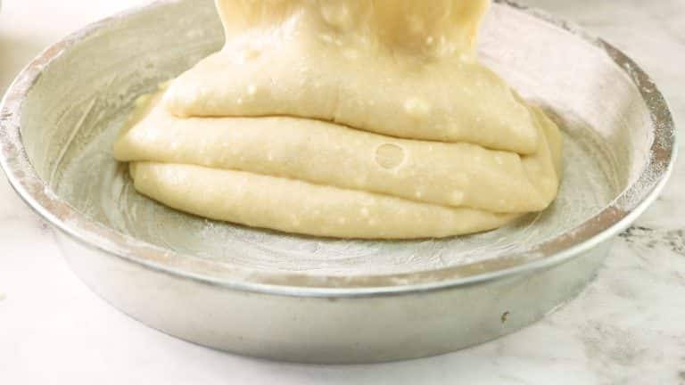 pouring the cake batter into the pan