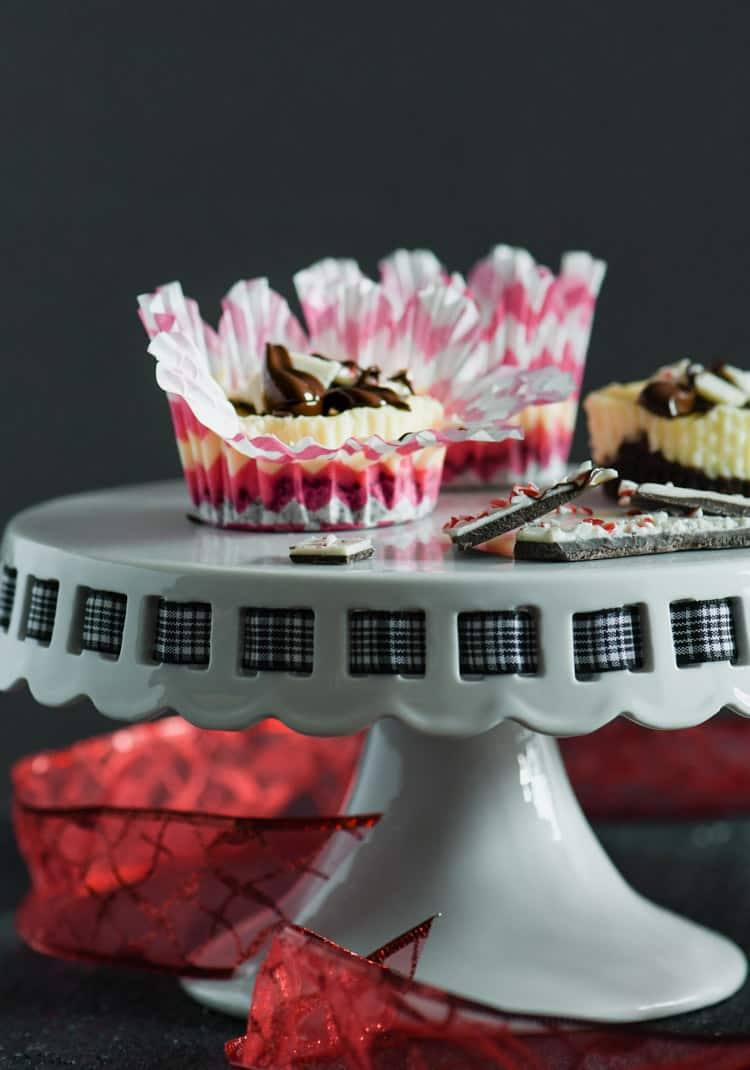 Peppermint Bark Mini Cheesecakes are sure to be a holiday crowd pleaser!