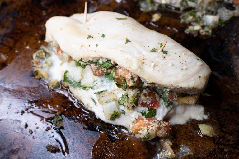 Pico de Gallo Cauliflower Rice Stuffed Baked Chicken on a cooking pan