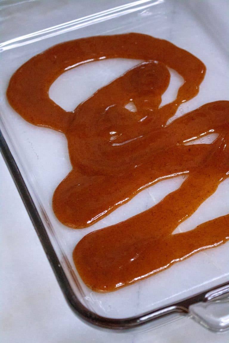 enchilada sauce for pork enchilada casserole spread in the bottom of a clear 13x9" pan