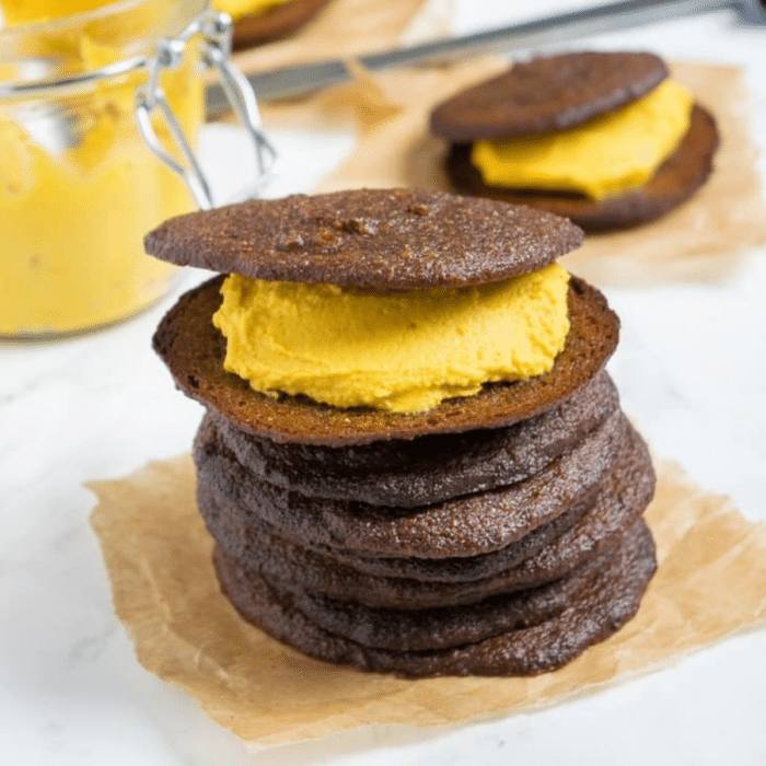 Pumpkin whoopie pies stacked with pumpkin cream filling