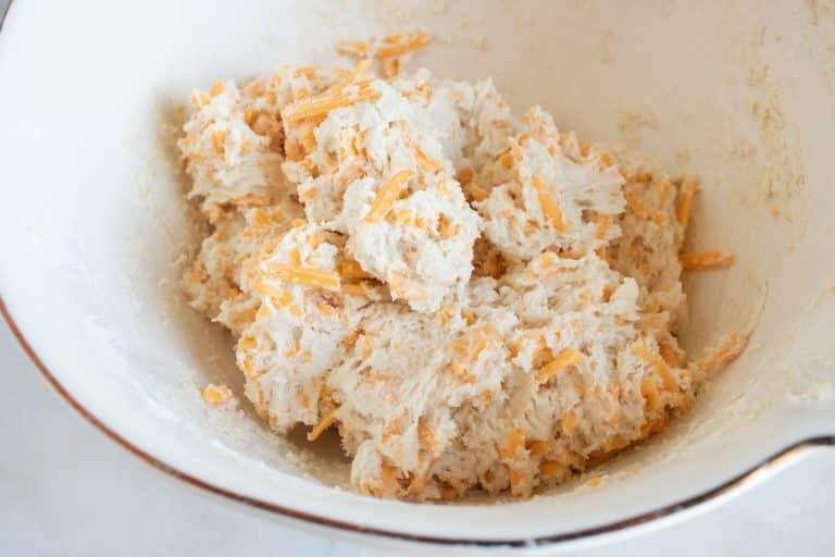The dough for making Red Lobster Copycat Cheddar Biscuits, being folded together.