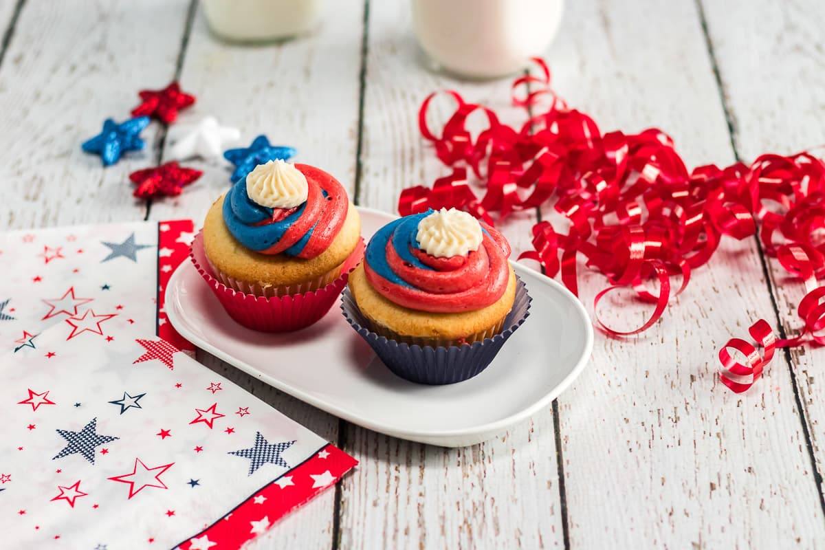 Red white and blue cupcakes on a serving plate ready to eat