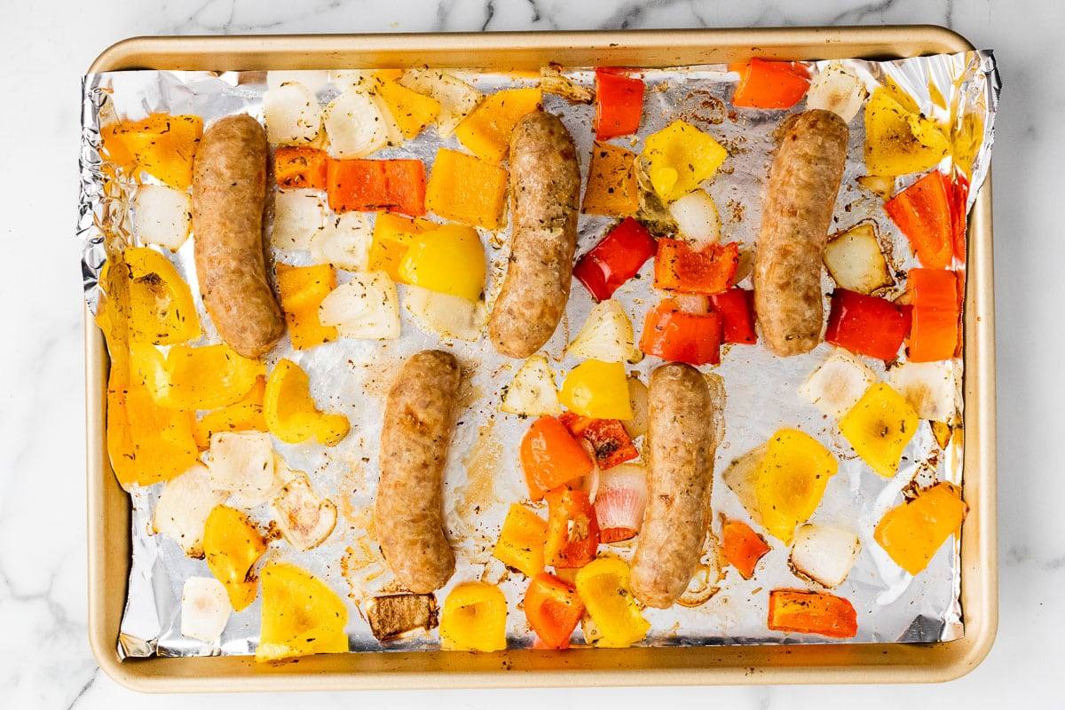 baking sheet full of sheet pan italian sausage and peppers