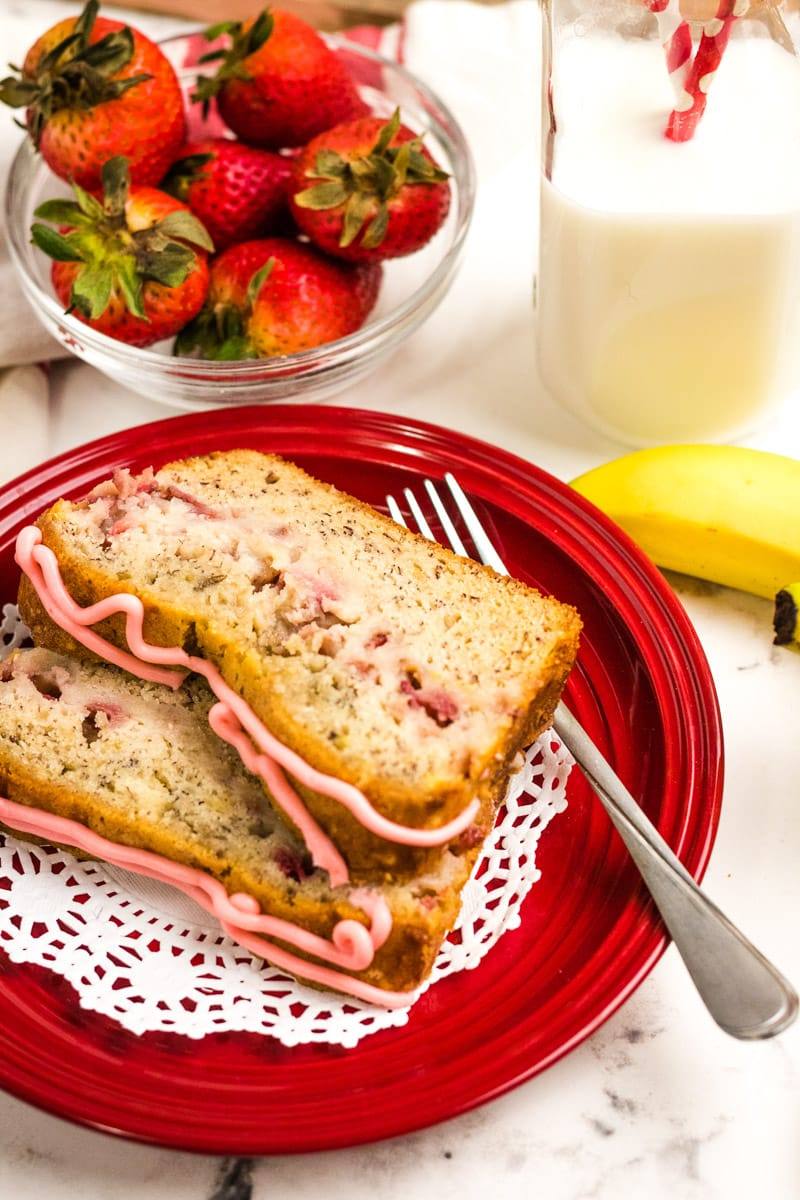 slices of strawberry banana bread being served on a plate