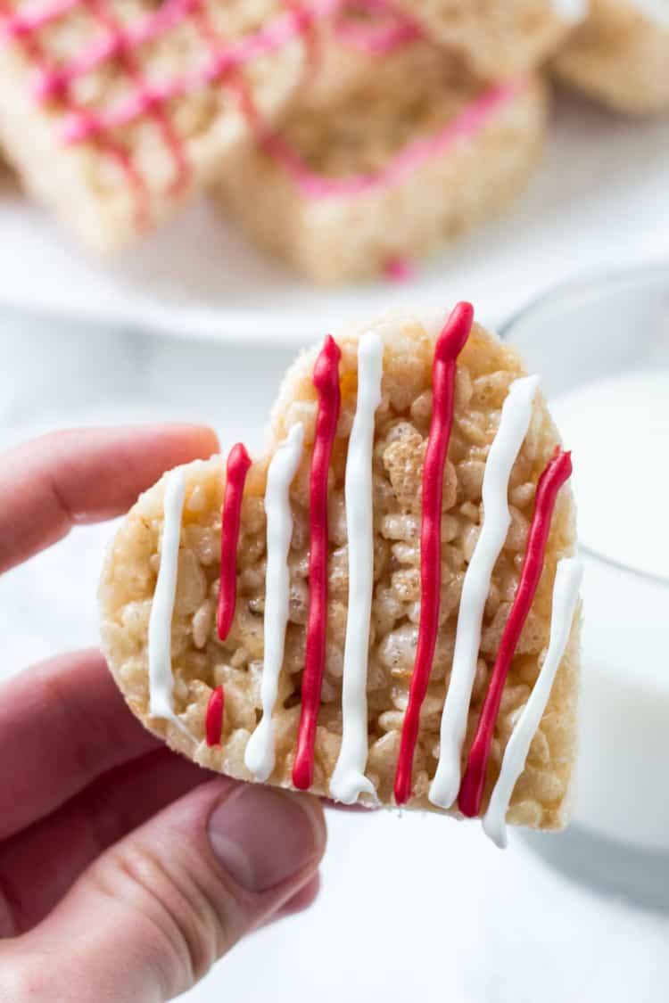 These Valentine's Rice Krispie treats are an easy, fun & festive recipe for February 14th. Kids will love making them, and they're a perfect treat to bring to school or Valentine's day parties.