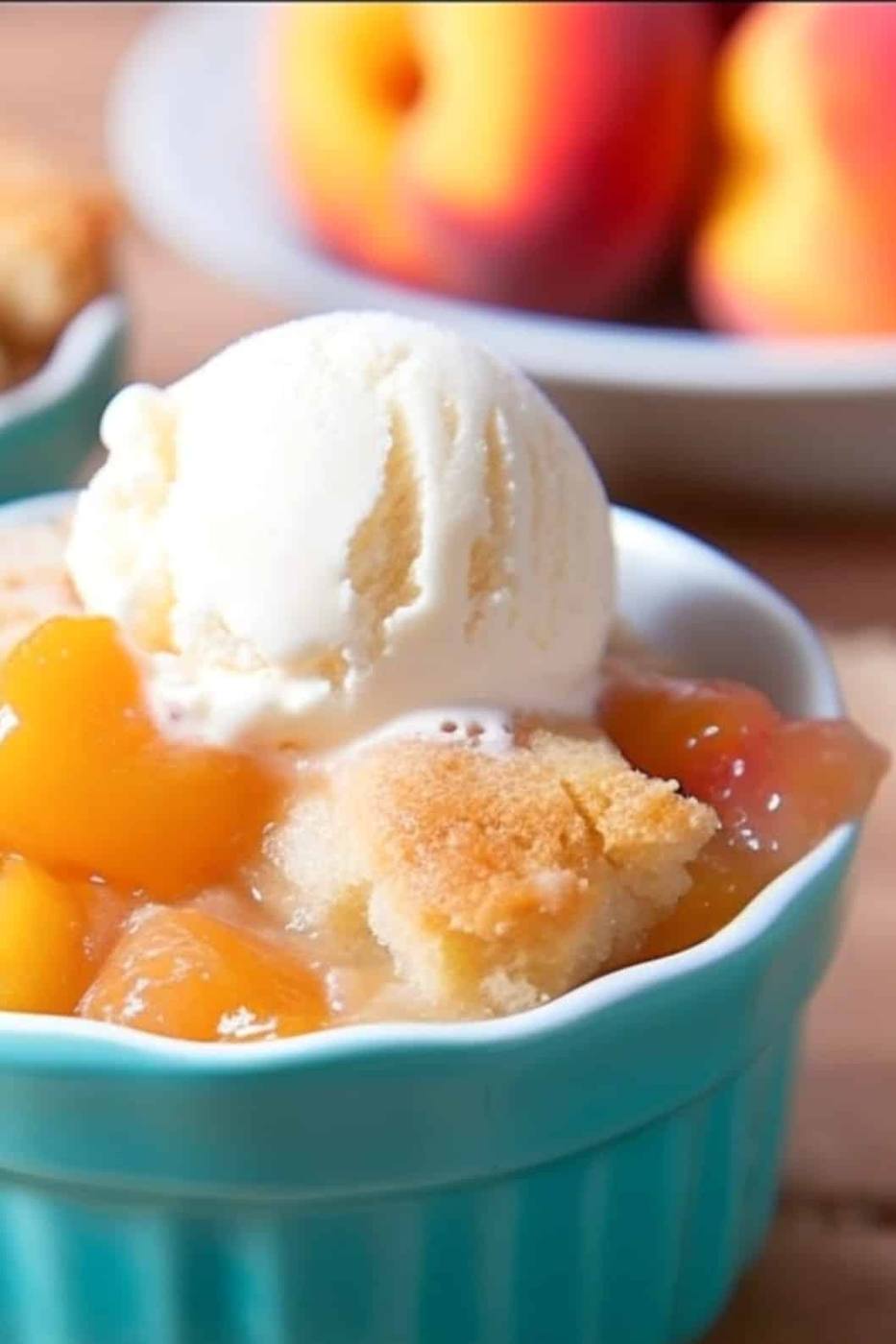 vertical shot of my peach cobbler being served