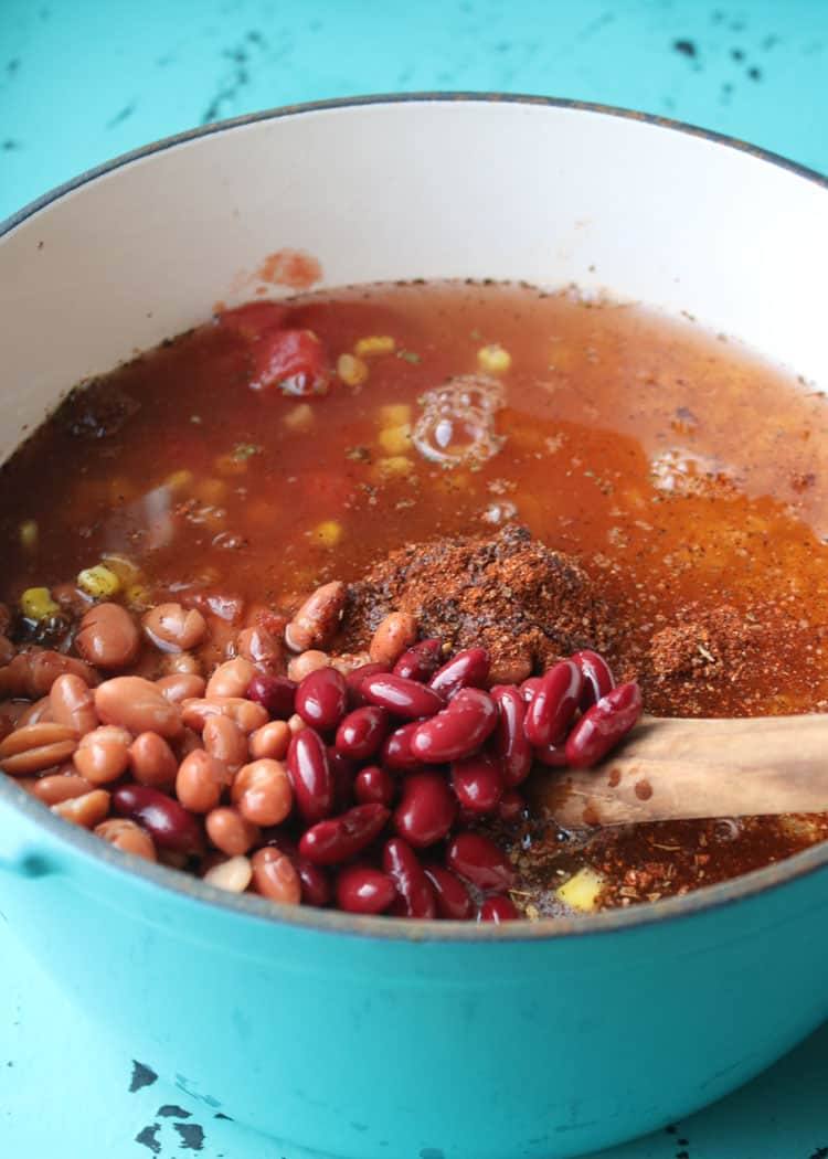 Finished Weight Watchers taco soup in a white bowl in front of the soup pot