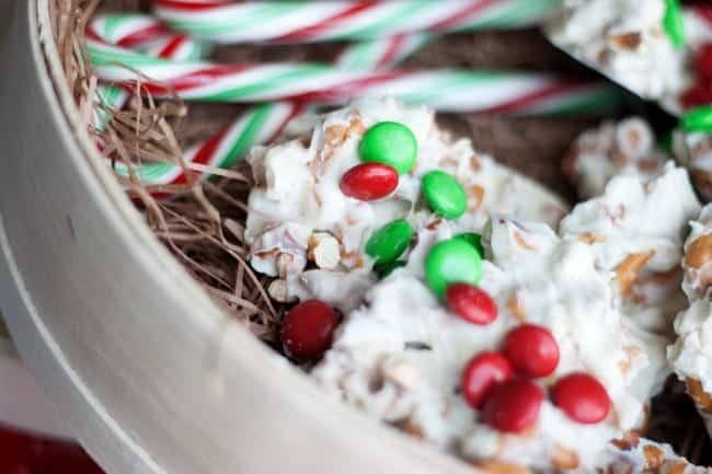 Close-up of white chocolate pretzel M&M clusters in a holiday gift box