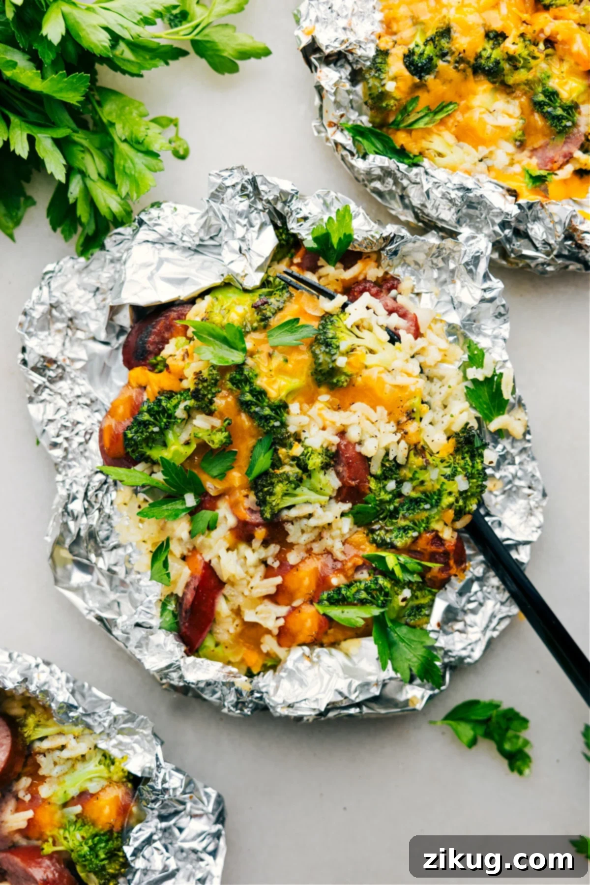 Foil Pack Cheesy Broccoli & Chicken fresh off the grill ready to be enjoyed.