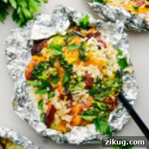 Foil Pack Cheesy Broccoli & Chicken fresh off the grill ready to be enjoyed.