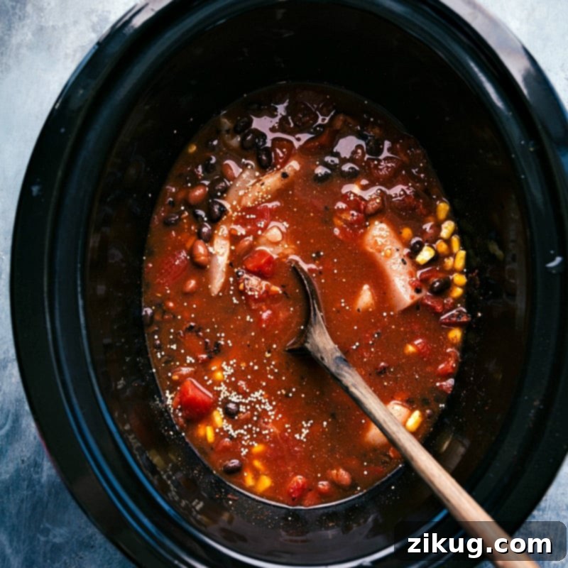 Hearty Slow Cooker Quinoa Chili 2 All the ingredients for the Crockpot Quinoa Chili are perfectly mixed together in the slow cooker, ready to be cooked to perfection.