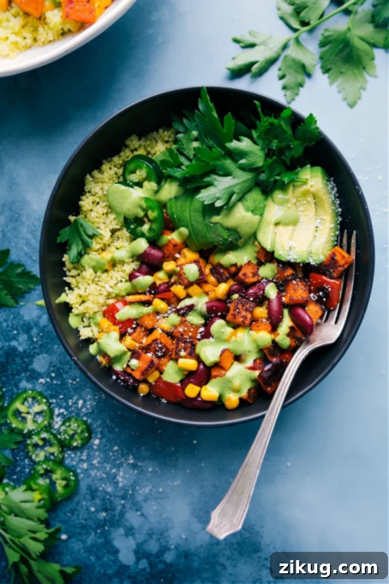 Hearty Meatless Kidney Bean Bowls with Roasted Veggies, Lemony Couscous, and Creamy Lemon-Herb Sauce. A perfect healthy meal prep option. Delicious Meatless Kidney Bean Bowls with roasted sweet potatoes, bell peppers, corn, and a vibrant lemon-herb sauce over couscous, ready to be served.