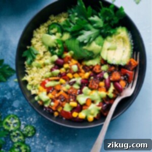 Finished Sweet Potato, Pepper, & Kidney Bean Bowls, garnished with fresh avocado slices.