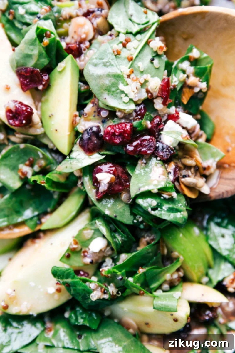 The fully mixed and dressed Quinoa and Almond Salad, showcasing all the complementary ingredients beautifully combined and ready to eat.
